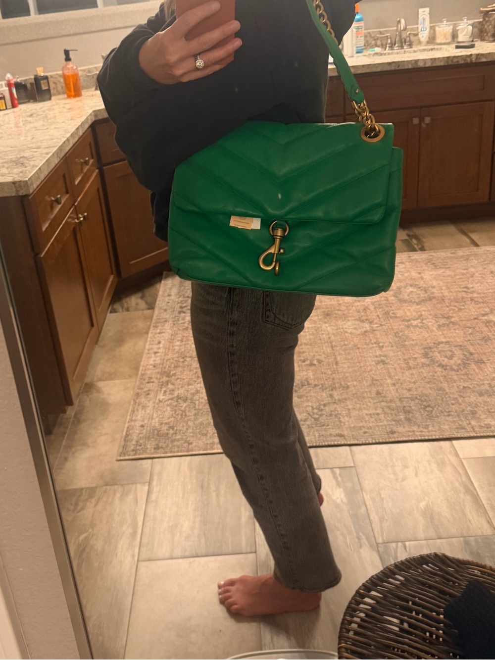 Rebecca Minkoff green quilted leather shoulder bag with gold-tone chain strap.